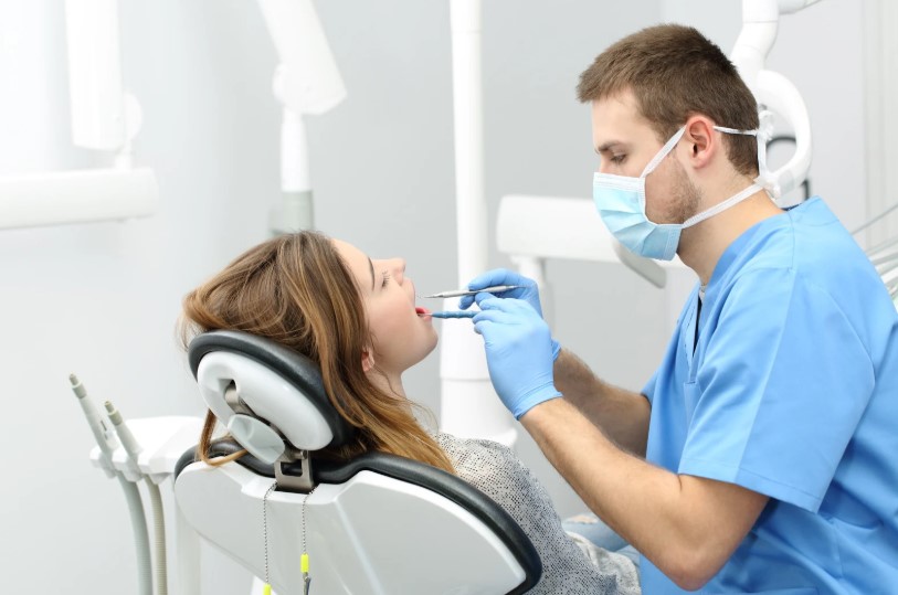 What does the dentist check during a preventive check-up?
